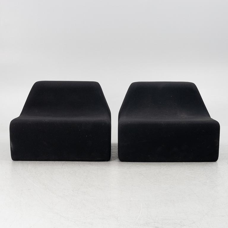 A pair of contemporary lounge chairs.