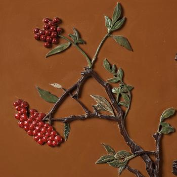 A lacquer wall panel with inlay of stone, cloisonné and porcelain, Qing dynasty, 19th Century.