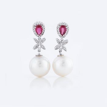 A pair of cultured pearl, ca 1.08 cts ruby and 0.34 cts brilliant cut diamond earrings.