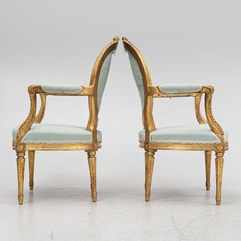 A sofa and a pair of chairs, Louis XVI style, circa 1900.