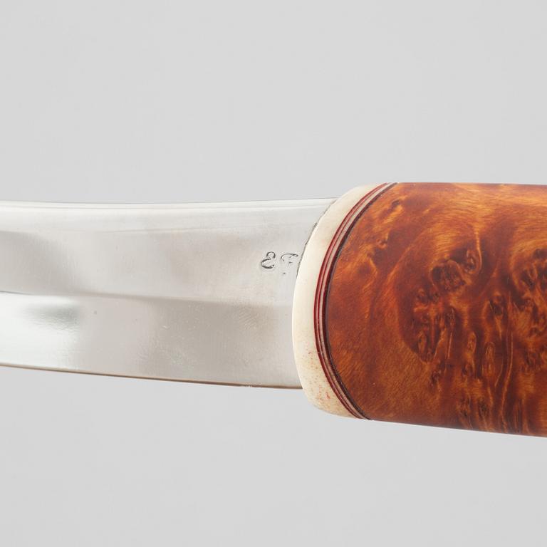 Erik Fankki, a reindeer horn knife, signed and dated 2004.