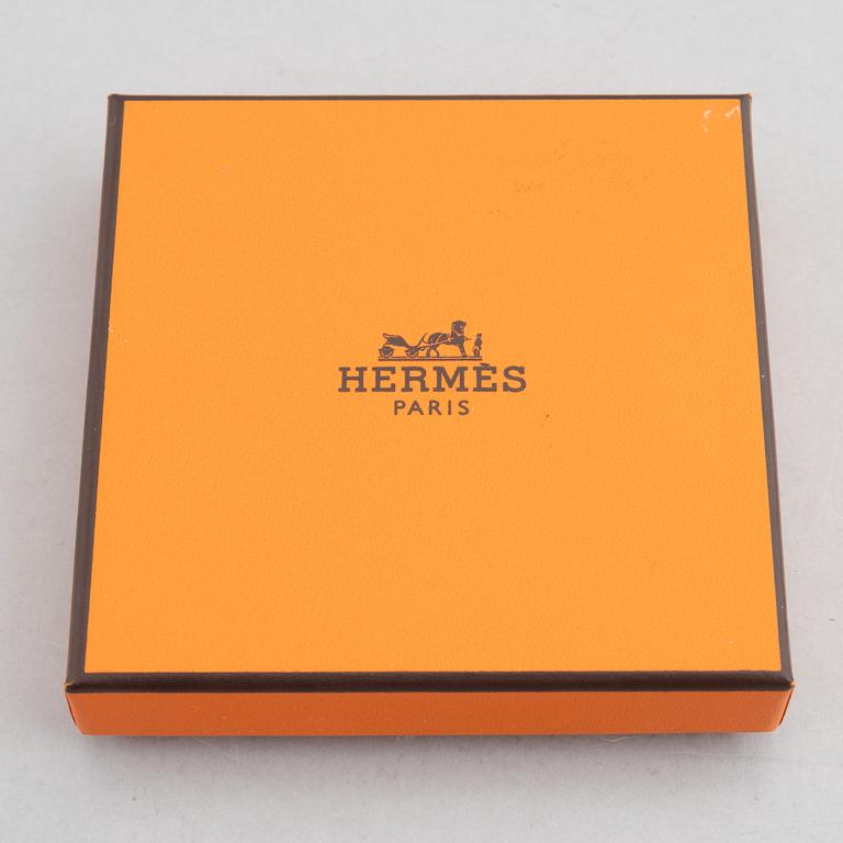 Hermès, a 'Clic H' bracelet.