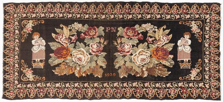 A Kelim carpet, Moldova, dated 1939, circa 385 x 174 cm.