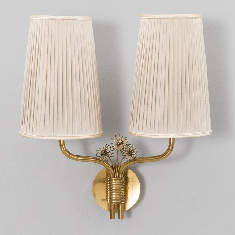 A mid-20th century wall light model 9446 for Taito, Finland.