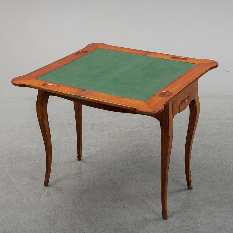 A Swedish Rococo folding top game table by Johan Wilhelm Metzmacher (master in Stockholm 1769-1783).