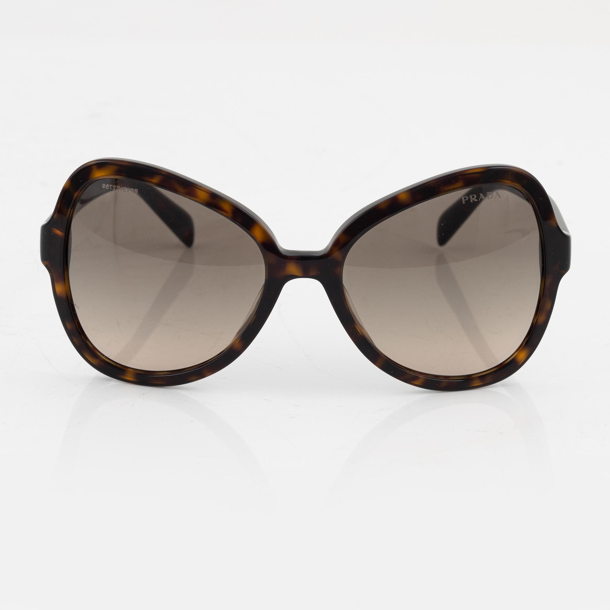 Prada, a pair of tortoise color sunglasses.