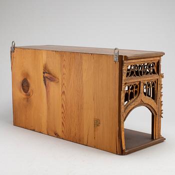 A Gothic style wall shelf, circa 1900.