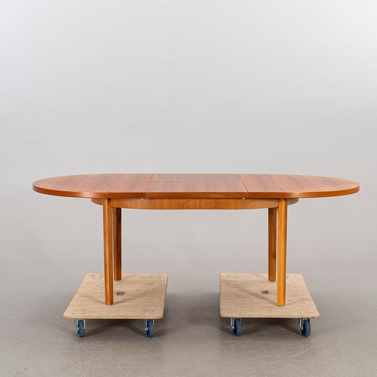 A mid 20th century teak dining table.