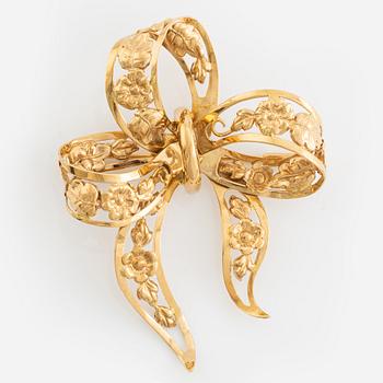 18K gold bow brooch.