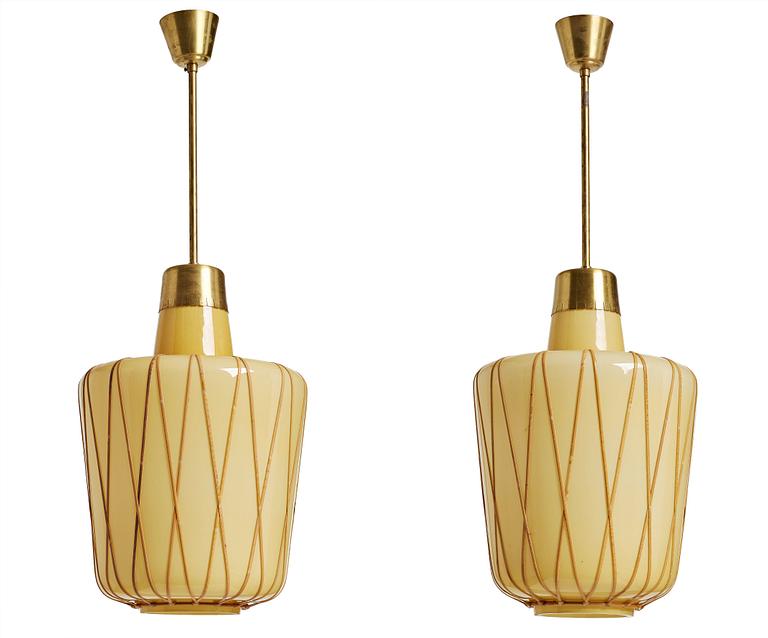 A pair of Swedish vanilla coloured glass ceiling lights with fretted rattan, 1930-40's.