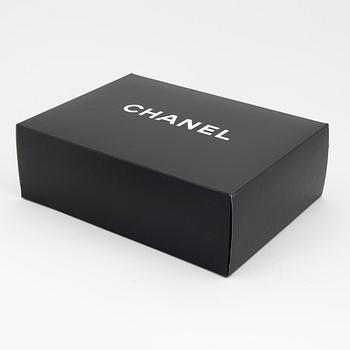 Chanel, a black caviar leather briefcase.
