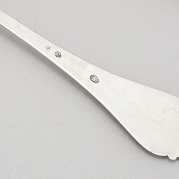 Johan Rohde, an 'Acorn' sterling sauce ladle, Georg Jensen post 1945 + a Danish silver serving spoon, Copenhagen 1931.