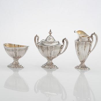 A five-piece sterling silver coffee and tea service, and 12 spoons, USA, first quarter of the 20th century.