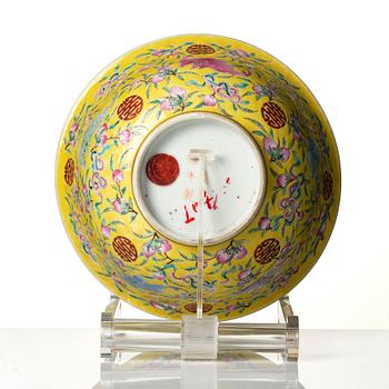A yellow glazed 'nine bats and peaches' bowl, late Qing dynasty with Guangxu mark.