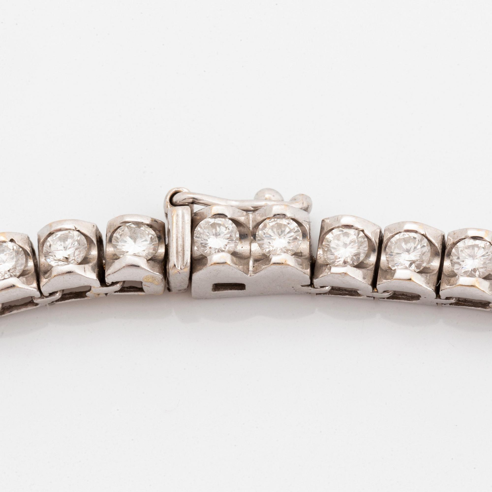 Collier rivière 18K vitguld runda briljantslipade diamanter.