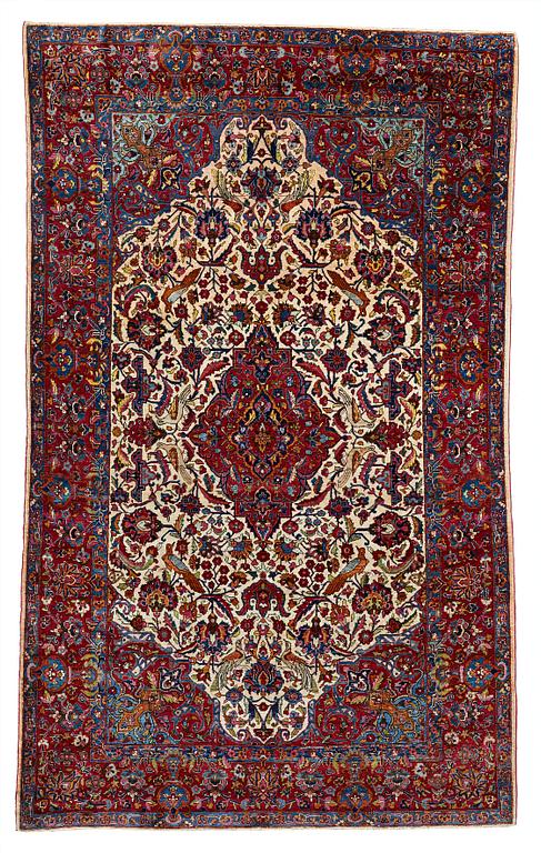 A CARPET, a semi-antique silk Kashan, ca 208,5 x 130 cm.