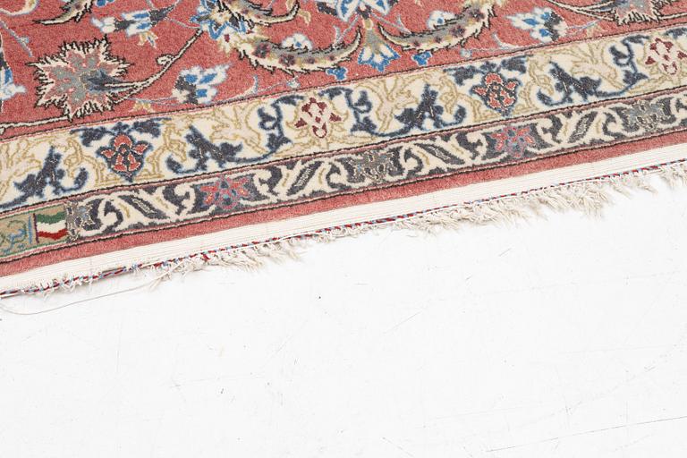 An Isfahan carpet, signed, approx. 372 x 255 cm.