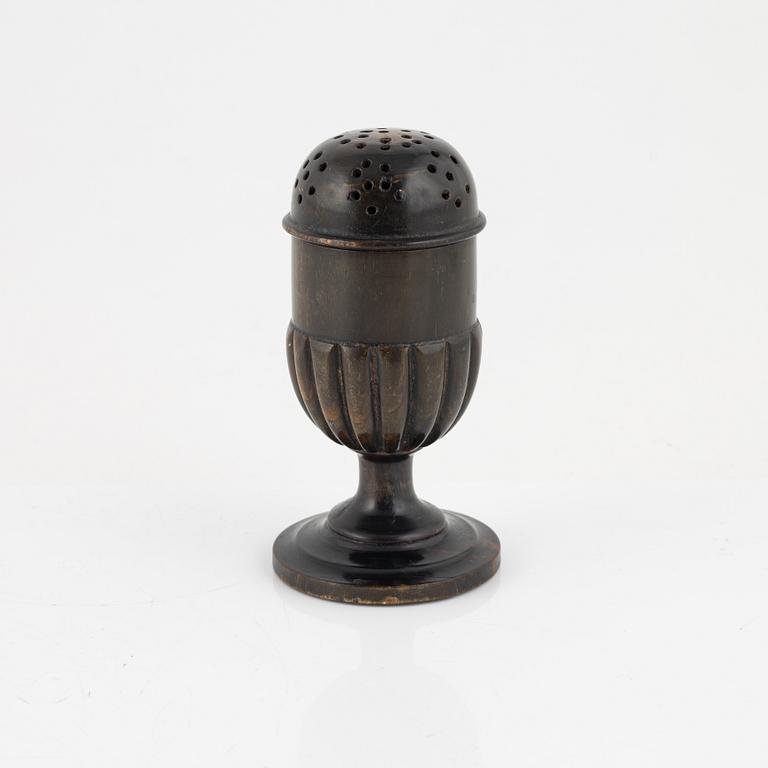 A 18th Century horn saltshaker.