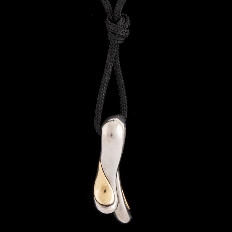 A silver and gold pendant by Minas Spiridis for Georg Jensen, designed in the 1990's.
