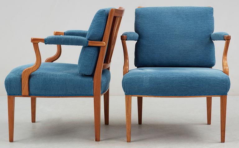 A pair of Josef Frank mahogany, ratten and blue fabric armchairs, Svenskt Tenn, model 969.