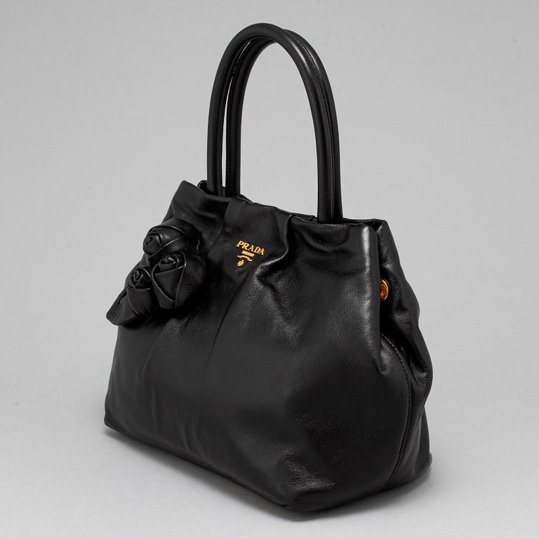 PRADA, black leather bag.