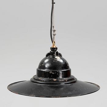 An early 20th century industrial lamp.