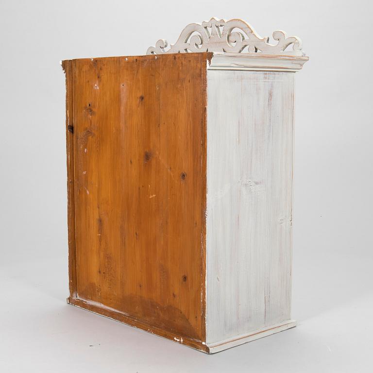A late 19th-century wooden wall cabinet.