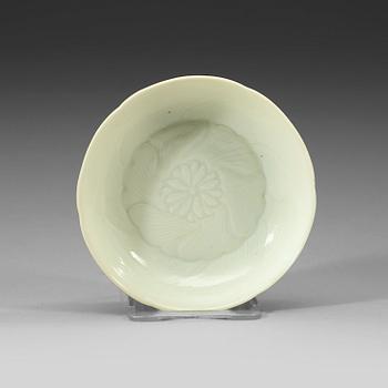 A white-glazed moulded small dish, Qing dynasty, 18th century.