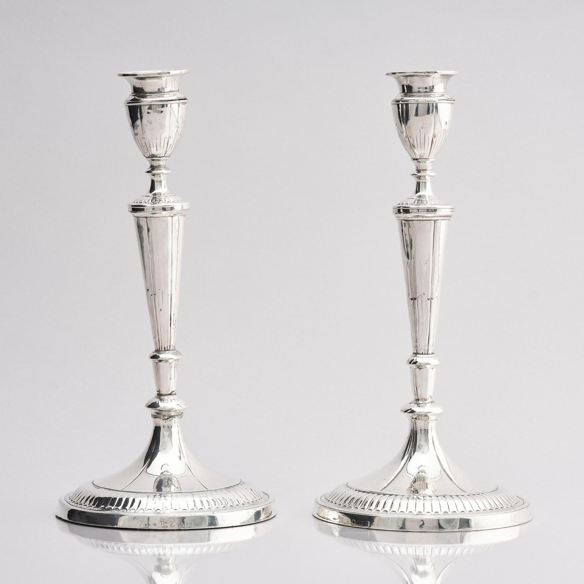 A pair of 18th century silver candlesticks, marks of John Parson & Co, Sheffield 1791.