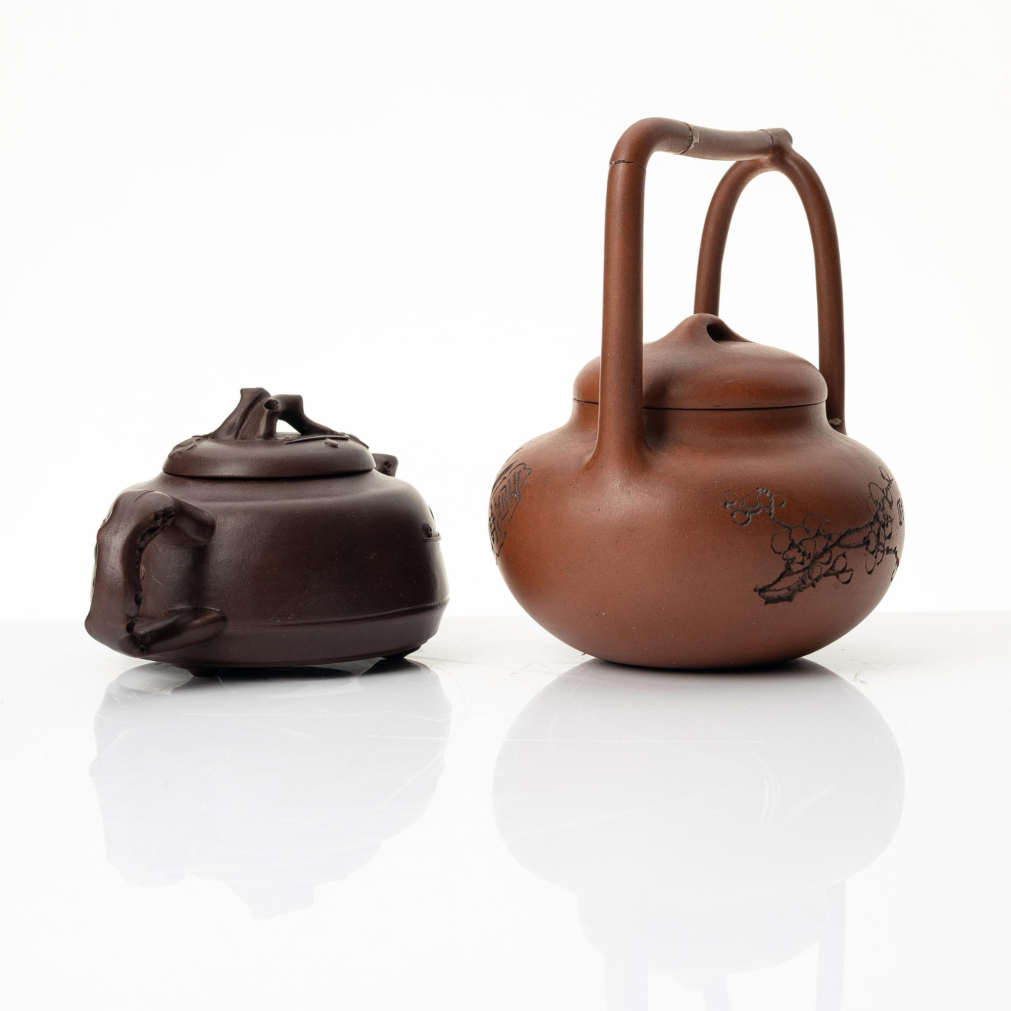 Two Chinese yixing teapots, early 1900s and 1980s.