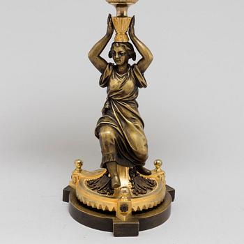 AN EMPIRE ORMOLU TABLE MIRROR, first half of the 19th century.