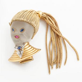 A 1960's brooch, signed Van Cleef and Arpels, no. 77381, made in rock quartz set with a ruby, sapphires and diamonds.