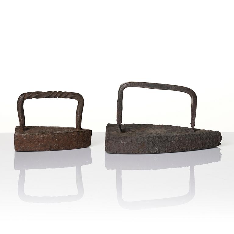 Two cast iron clothes irons, 18th / early 19th century.