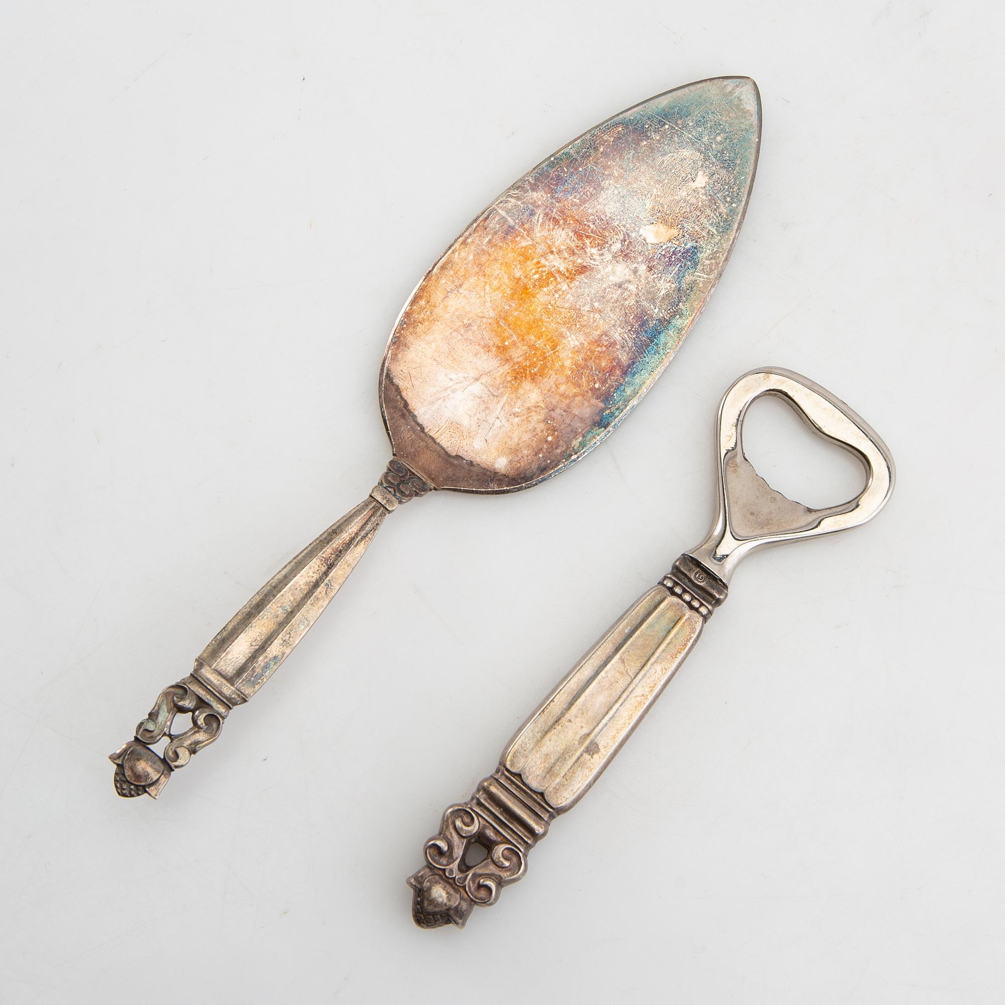 Johan Rohde, flasköppnare och tårtspade "Konge/Achorn" sterlingsilver för Georg Jensen efter 1945.