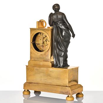 A French Empire early 19th century mantel clock, by Antoine André Ravrio.