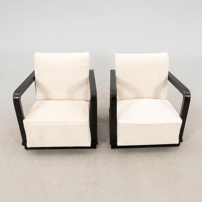 A pair of Art Deco armchairs.