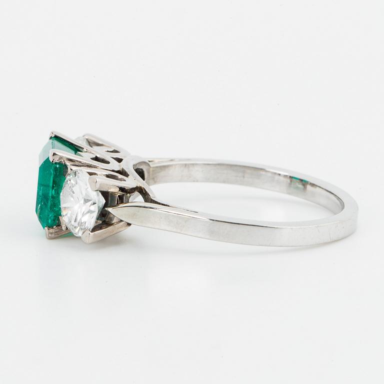 Emerald and brilliant-cut diamond three stone ring.