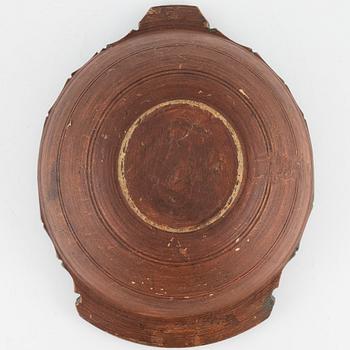 A lathed and painted bowl dated 1783.