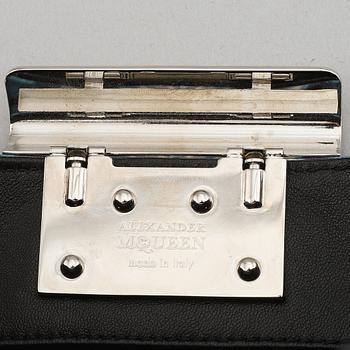 Alexander McQueen, a fabric clutch.