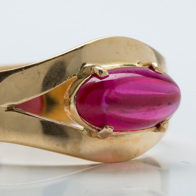 A cabochon-cut ruby ring.