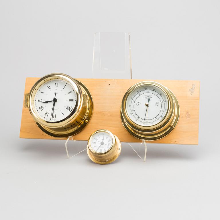 TWO BRASS MARINE CLOCK AND A BAROMETER BY STOCKBURGER.