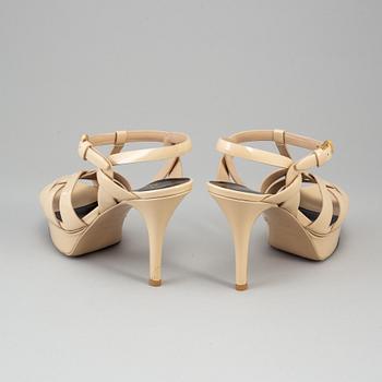 YVES SAINT LAURENT, a pair of open toe patent leather shoes, size 36½.