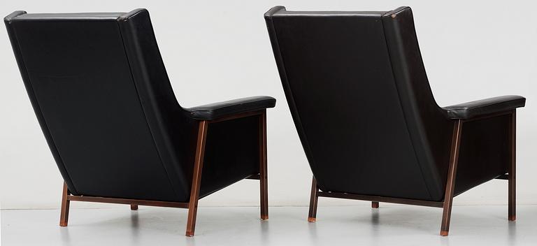 A pair of Karl- Erik Ekselius black leather armchairs, JOC, Vetlanda early 1960's.
