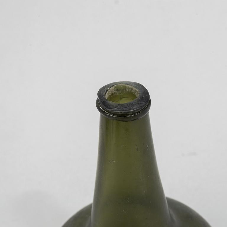 A glass bottle, 18th century.