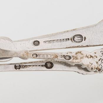 A set of  four silver serving spoons, with a set of 12 coffee spoons, Denmark, early and first half of the 20th century.