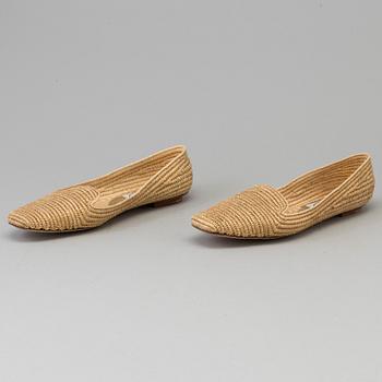 A pair of raffia shoes by Emma Hope's.