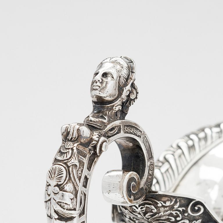 A sterling silver wine ewer, maker's marks of Robert Roskell, Alan Roskell & John Mortimer Hunt, London 1885.