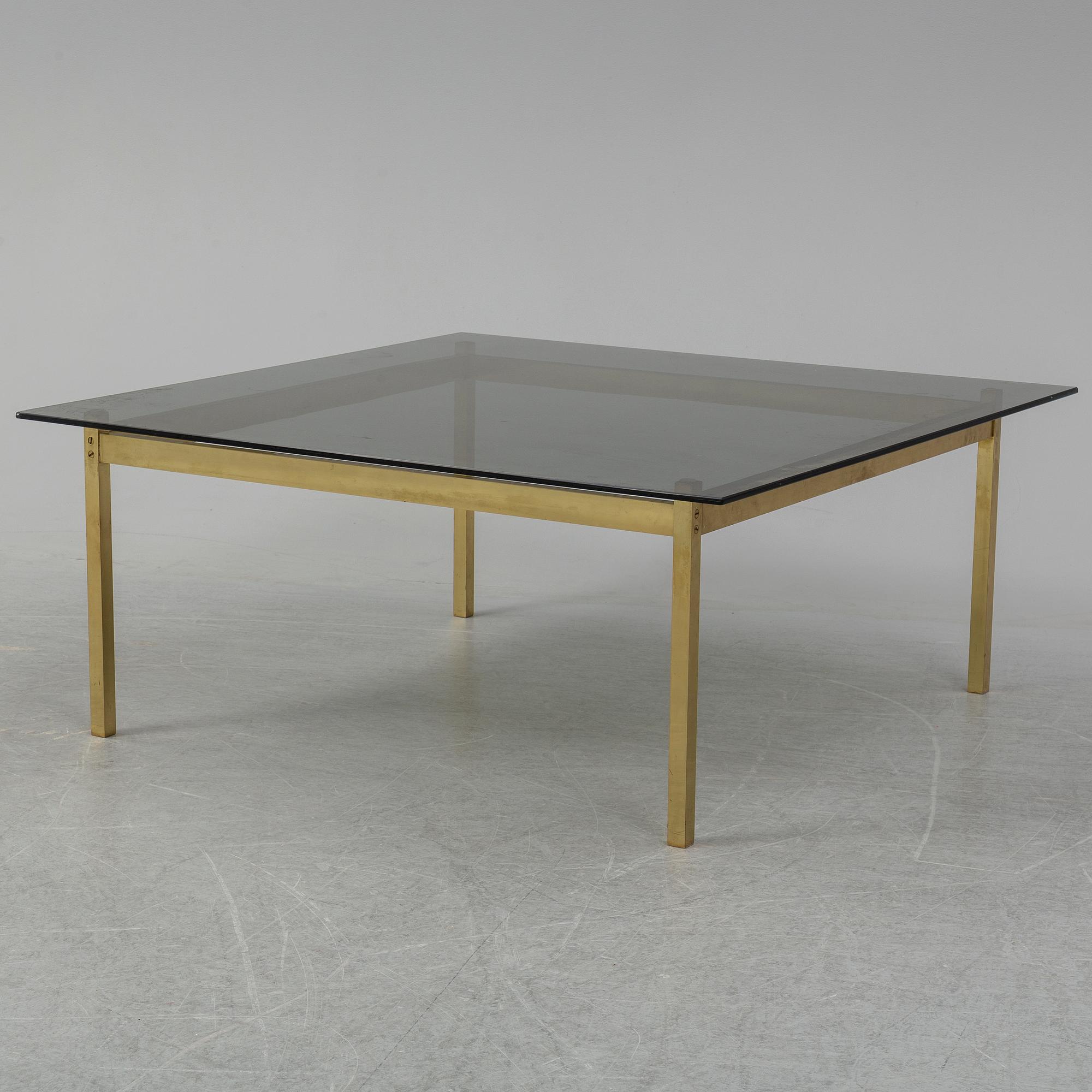 A 1960-70's brass and glass coffee table.