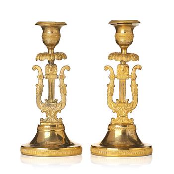 176. A pair of Swedish Empire ormula candlesticks.