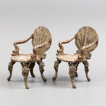 A pair of 20th century grotto armchairs.